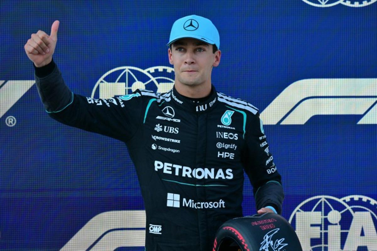 Pole position winner Mercedes' British driver George Russell poses with the pole position award after the qualifying session at the Red Bull Ring race track in Spielberg, Austria on June 27, 2026, ahead of the Formula One Austrian Grand Prix.  Andrej ISAKOVIC / AFP