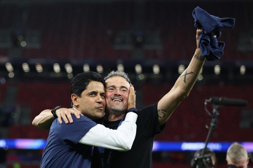 Paris Saint Germain's Qatari president Nasser al-Khelaifi (L) and Paris Saint-Germain's Spanish head coach Luis Enrique celebrate after winning the UEFA Champions League final football match between Paris Saint-Germain (PSG) and Arsenal FC at the Puskas Arena in Budapest on May 30, 2026.   FRANCK FIFE / AFP