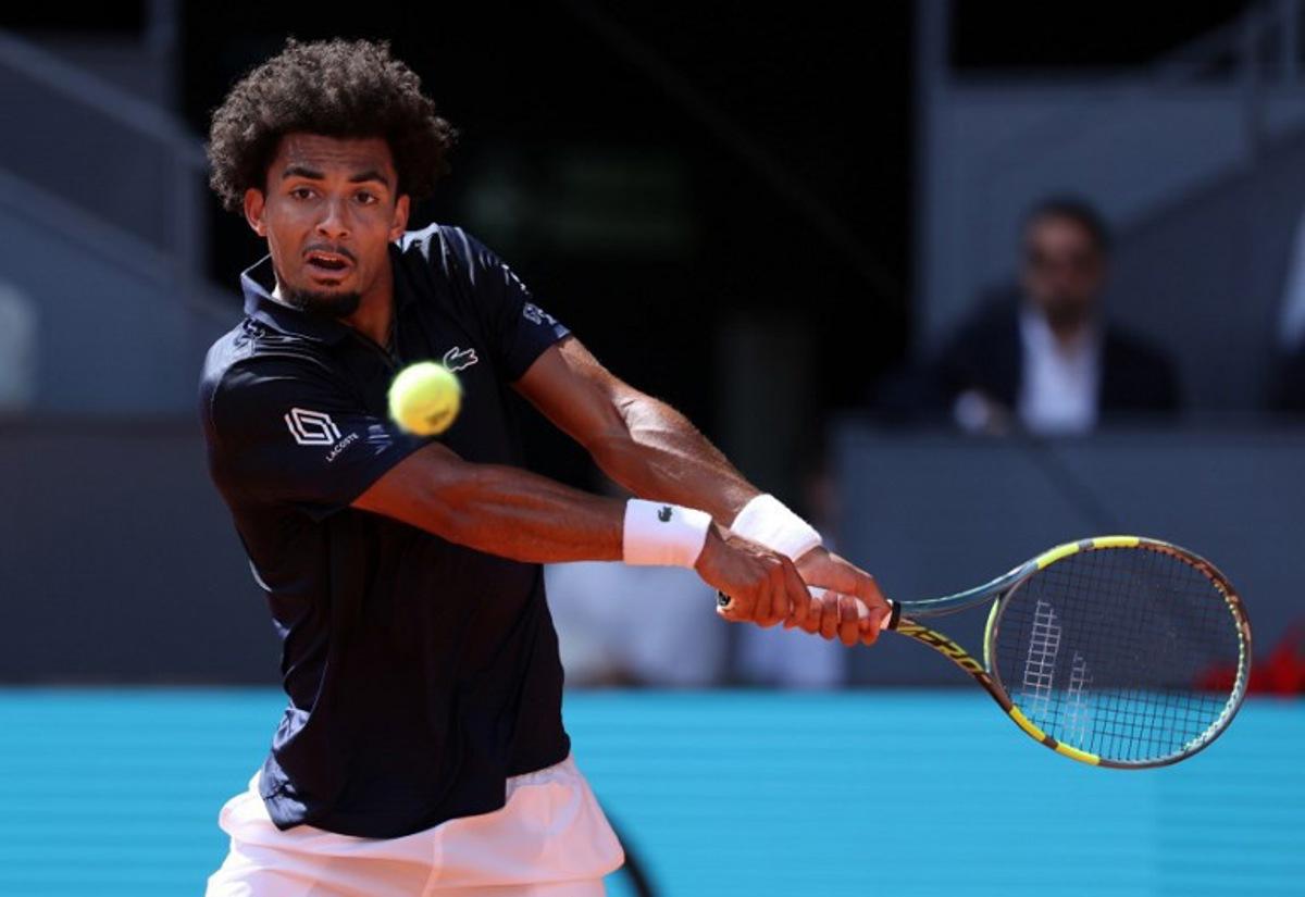 France's Arthur Fils returns the ball to Italy's Jannik Sinner during their 2026 ATP Tour Madrid Open tennis tournament semi-final singles match at the Caja Magica in Madrid, on May 1, 2026.  Thomas COEX / AFP