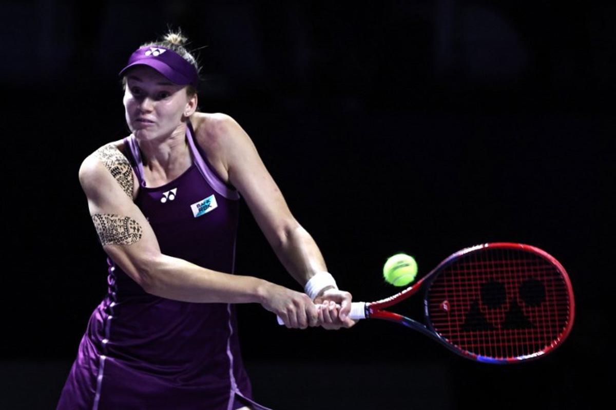 Kazakhstan's Elena Rybakina returns the ball to Russia's Ekaterina Alexandrova during their WTA Finals tennis tournament in Riyadh on November 5, 2025.  Fayez NURELDINE / AFP