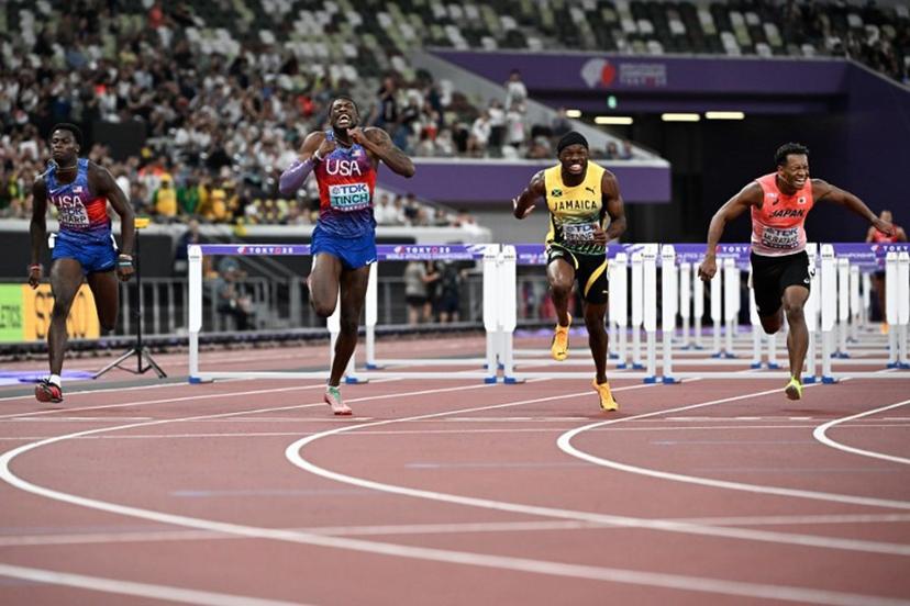 (L-R) US' athlete Ja'Kobe Tharp, US' athlete Cordell Tinch, Jamaica's Orlando Bennett and Japan's athlete Rachid Muratake cross the finish line in the men's 110m hurdles final during the World Athletics Championships in Tokyo on September 16, 2025.  Jewel SAMAD / AFP