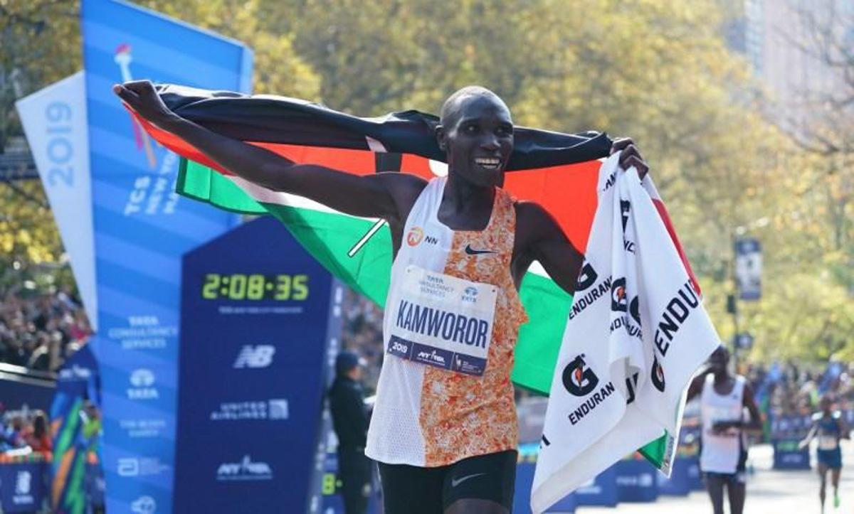 Geoffrey Kamworor of Kenya cheers after he crosses the finish line to win the Professional Men's Finish  during the 2019 TCS New York City Marathon in New York on November 3, 2019. Geoffrey Kamworor and Joyciline Jepkosgei sealed a double victory for Kenya at the New York Marathon on Sunday, storming to convincing wins in the men's and women's races at the annual showpiece. Kamworor, the 2017 New York champion, pulled clear in the closing stages to take the tape in Central Park 2hr 8min 13sec.  TIMOTHY A. CLARY / AFP