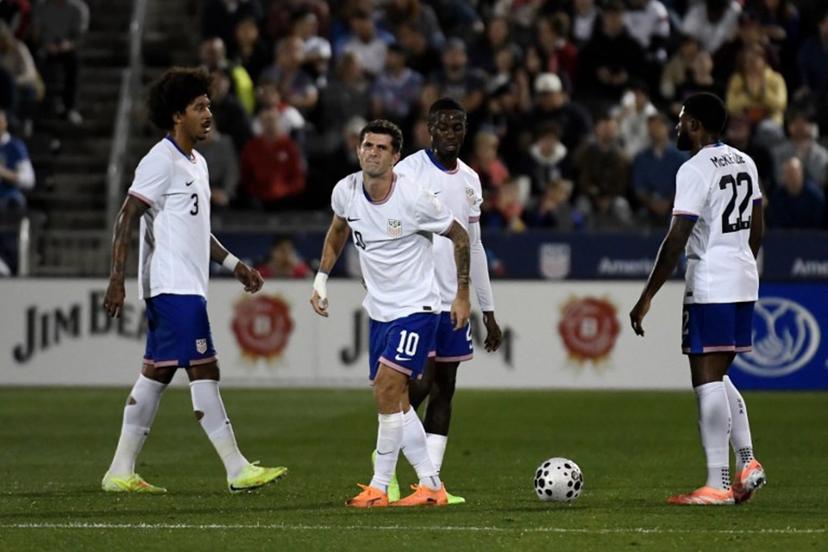 USA's midfielder #10 Christian Pulisic limps after being tripped during the international friendly football match between USA and Australia at Dick's Sporting Goods Park in Commerce City, Colorado, on October 14, 2025.  Jason Connolly / AFP