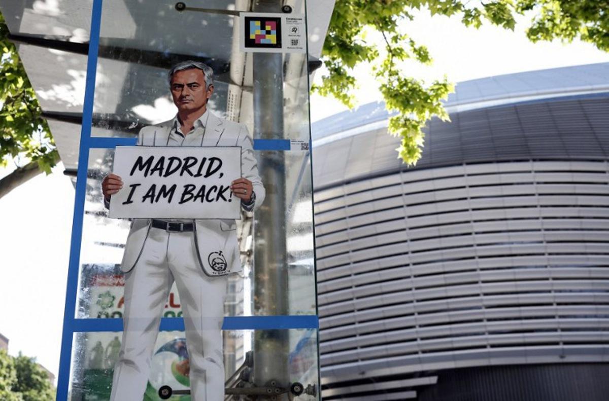 A mural by Italian urban artist Salvatore Benintende aka "TV BOY" depicting Portuguese coach Jose Mourinho is seen in front of the Santiago Bernabeu stadium in Madrid on May 21, 2026.   Benfica coach Jose Mourinho confirmed on May 17, 2026 his agent Jorge Mendes has been in contact with Spanish giants Real Madrid. The veteran Portuguese coach, 63, has been strongly linked with a sensational return to the Santiago Bernabeu 13 years after he left Los Blancos. Mourinho said he personally has not had any contact with Madrid president Florentino Perez, or anyone else at the club, and that his future will be decided in the coming week.  OSCAR DEL POZO / AFP