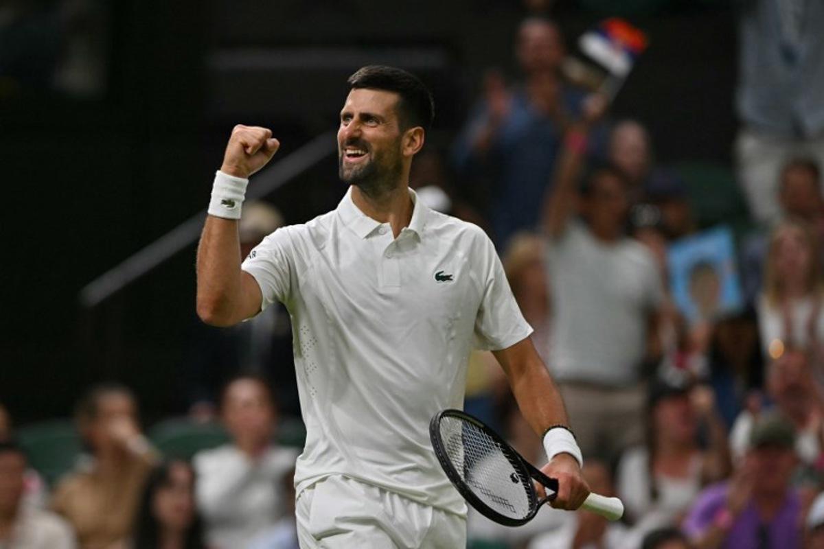 Serbia's Novak Djokovic reacts as he plays against China's Yibing Wu during their men's singles first round tennis match on the first day of the 2026 Wimbledon Championships at The All England Lawn Tennis and Croquet Club in Wimbledon, southwest London, on June 29, 2026.  Glyn KIRK / AFP