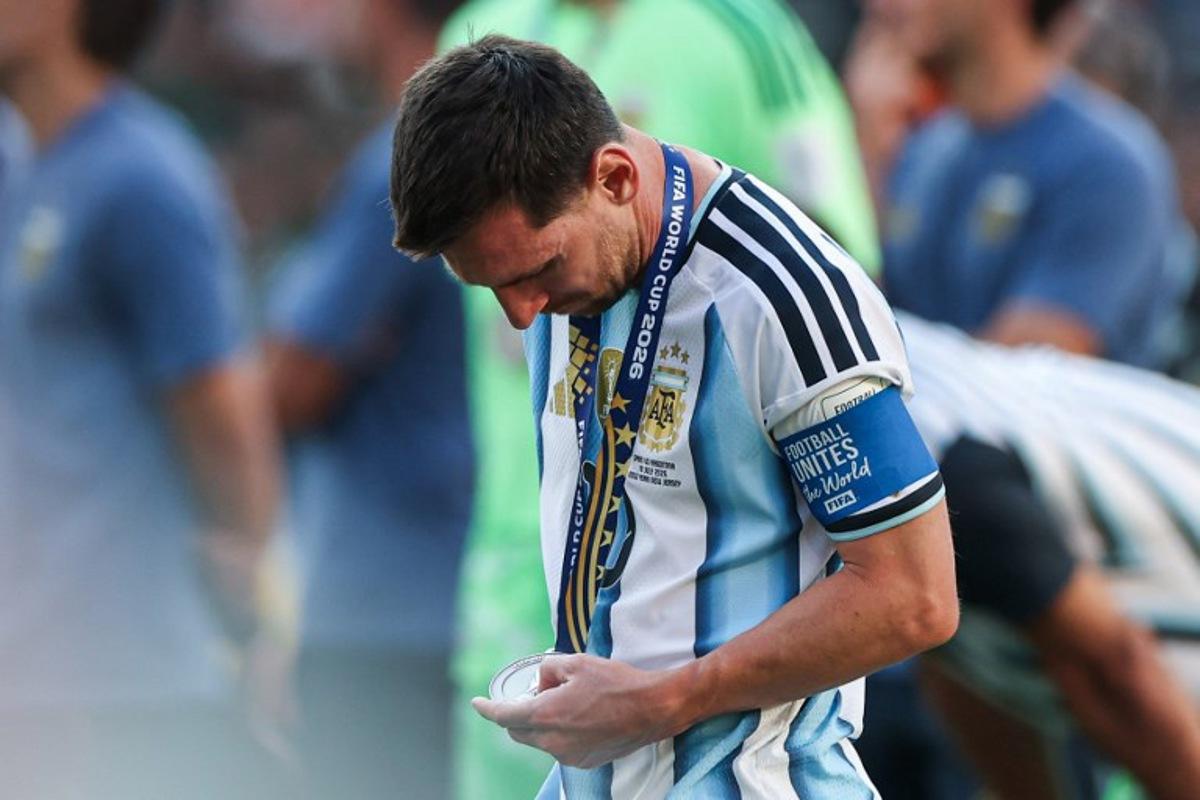 Argentina's forward #10 Lionel Messi looks at his second place medal after losing the 2026 World Cup football tournament final match between Spain and Argentina at the New York/New Jersey Stadium in East Rutherford on July 19, 2026.   PATRICIA DE MELO MOREIRA / AFP