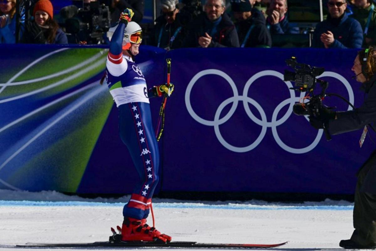 US' Breezy Johnson reacts in the finish area of the women's downhill event during the Milano Cortina 2026 Winter Olympic Games at the Tofane Alpine Skiing Centre in Cortina d'Ampezzo on February 8, 2026.  Stefano RELLANDINI / AFP