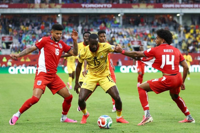 Panama's defender #16 Andres Andrade, Ghana's midfielder #15 Elisha Owusu and Panama's midfielder #14 Carlos Harvey fight for the ball during the 2026 World Cup Group L football match between Ghana and Panama at the Toronto Stadium in Toronto on June 17, 2026.   Cole Burston / AFP