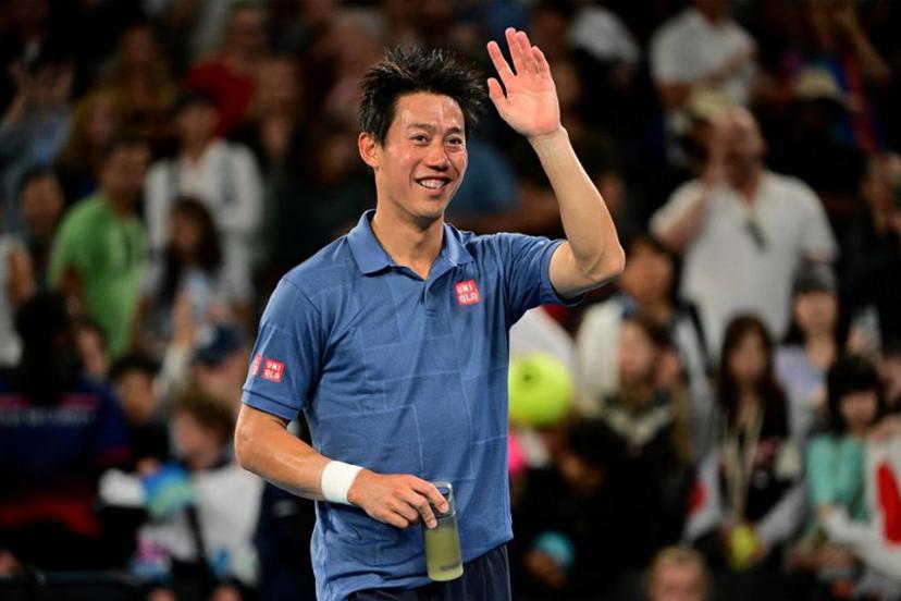 Japan's Kei Nishikori celebrates after his victory against Brazil's Thiago Monteiro in their men's singles match on day one of the Australian Open tennis tournament in Melbourne on January 12, 2025.   Yuichi YAMAZAKI / AFP