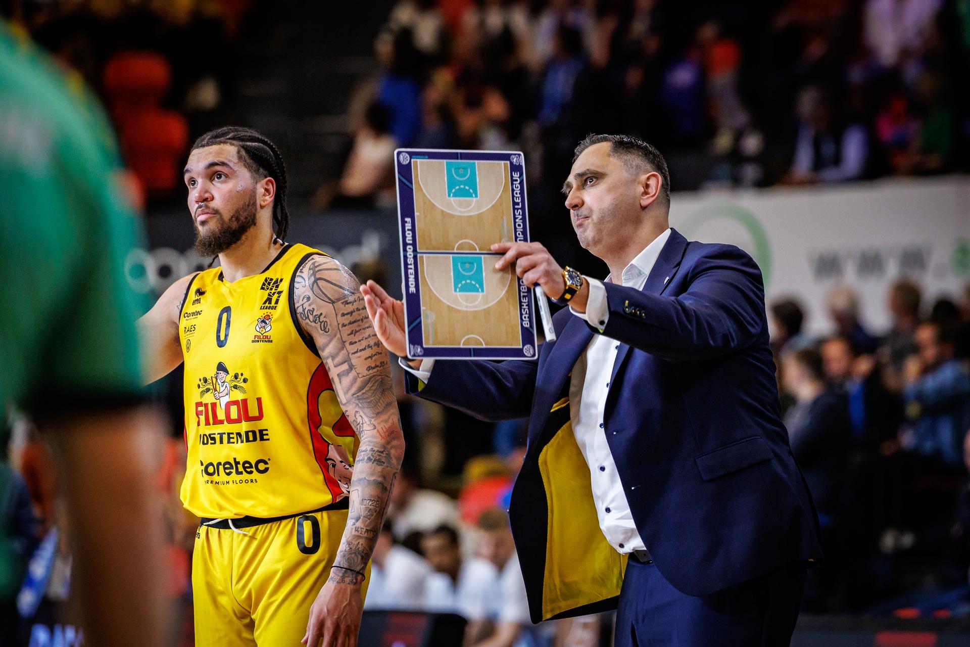 Oostende's Timmy Allen and Oostende's head coach Dario Gjergja pictured during a basketball match between BC Oostende and Okapi Aalst, Friday 21 March 2025 in Oostende, on day 27 of the 'BNXT League' Belgian and Dutch first division basket championships. BELGA PHOTO KURT DESPLENTER