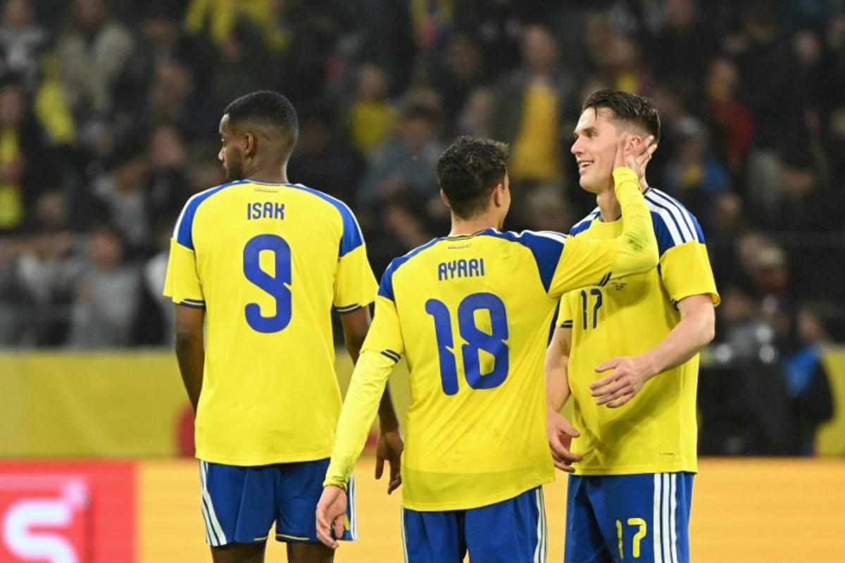 Sweden's forward #17 Viktor Gyokeres (R) celebrates scoring his team's first goal with teammates Sweden's midfielder #18 Yasin Abbas Ayari (C) and Sweden's forward #09 Alexander Isak during the friendly match between Sweden and Greece ahead of the 2026 FIFA World Cup football tournament, in Solna, near Stockholm, on June 4, 2026.  Jonathan Nackstrand / AFP