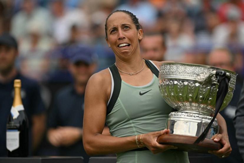 US player Madison Keys reacts as she poses with the trophy after her win over Germany's Tatjana Maria during their women's final tennis match on day six of the Lexus Eastbourne Open at Devonshire Park, Eastbourne, on the south coast of England on June 27, 2026.  Glyn KIRK / AFP