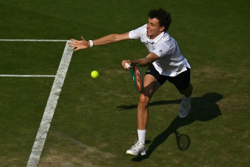France's Ugo Humbert returns against Britain's Jack Draper during their men's semi-final tennis match on day five of the Lexus Eastbourne Open at Devonshire Park, Eastbourne, on the south coast of England on June 26, 2026.  Glyn KIRK / AFP