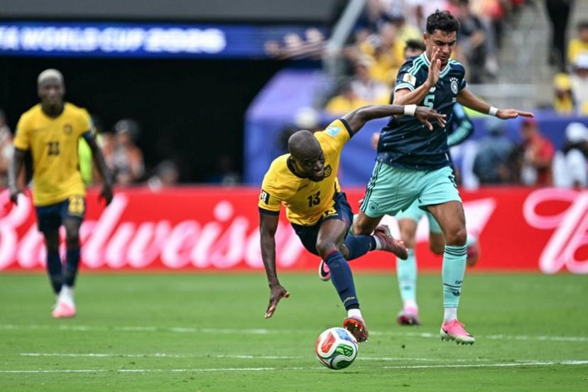 Ecuador's forward #13 Enner Valencia falls on the ground past Germany's defender #05 Aleksandar Pavlovic during the 2026 World Cup Group E football match between Ecuador and Germany at the New York/New Jersey Stadium in East Rutherford on June 25, 2026.  Jewel SAMAD / AFP