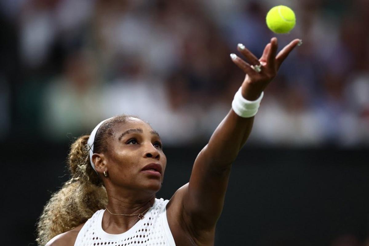 US player Serena Williams serves the ball to Australia's Maya Joint during their women's singles first round tennis match on the second day of the 2026 Wimbledon Championships at The All England Lawn Tennis and Croquet Club in Wimbledon, southwest London, on June 30, 2026.  HENRY NICHOLLS / AFP