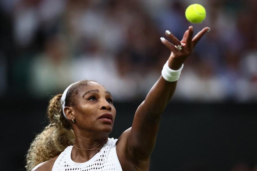 US player Serena Williams serves the ball to Australia's Maya Joint during their women's singles first round tennis match on the second day of the 2026 Wimbledon Championships at The All England Lawn Tennis and Croquet Club in Wimbledon, southwest London, on June 30, 2026.  HENRY NICHOLLS / AFP