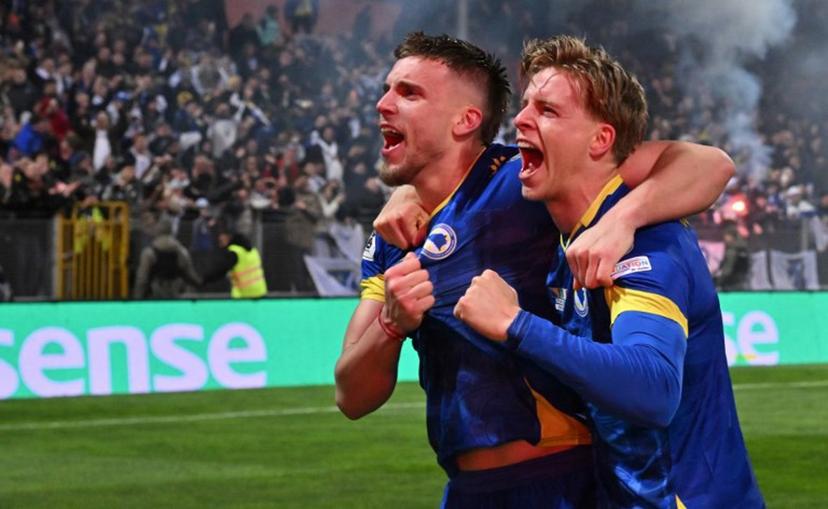Bosnia-Herzegovina's forward #10 Ermedin Demirovic (L) and Bosnia-Herzegovina's midfielder #17 Dzenis Burnic celebrate qualifying for the FIFA World Cup 2026 after Bosnia-Herzegovina won their European qualification final football match against Italy at the Bilino-Polje stadium in Zenica on March 31, 2026.   ELVIS BARUKCIC / AFP