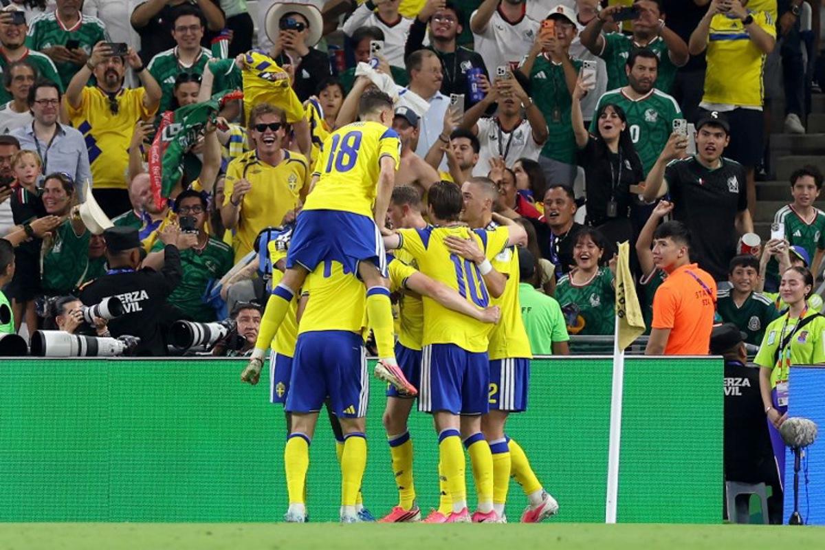 Sweden's forward #17 Viktor Gyokeres (unseen) celebrates with teammates scoring his team's third goal during the 2026 World Cup Group F football match between Sweden and Tunisia at the Monterrey Stadium in Guadalupe on June 14, 2026.   Julio Cesar AGUILAR / AFP