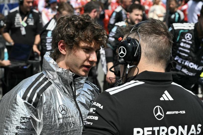 Mercedes' Italian driver Kimi Antonelli speaks with Mercedes' engineer Peter "Bono" Bonnington on the starting grid before the start of the 2026 Miami Formula One Sprint at Miami International Autodrome in Miami Gardens, Florida, on May 2, 2026.   CHANDAN KHANNA / AFP