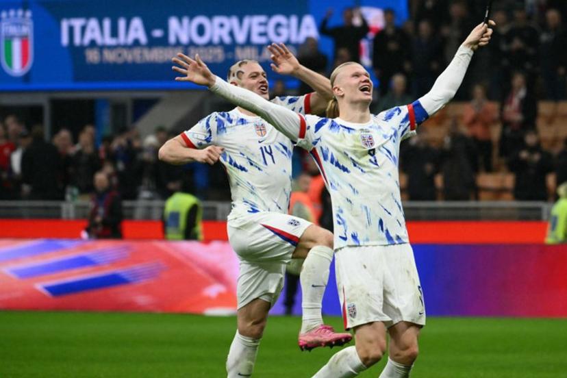 Norway's  captain #09 Erling Braut Haaland and Norway's  defender #14 Julian Ryerson celebrates their victory at the end of the FIFA World Cup 2026 European qualification football match between Italy and Norway, at the San Siro Stadium, in Milan, on November 16, 2025.     Alberto PIZZOLI / AFP