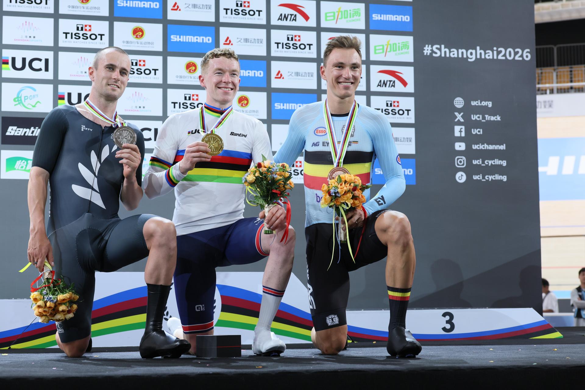 New Zealand's Tom Sexton; Britain's Matthew Bostock and Belgian Lindsay De Vylder celebrate on the podium after the Men's Scratch event at the UCI Track Cycling World Championships in Shanghai, China on Thursday 15 October 2026. The worlds are taking place from 14 to 18 October 2026. BELGA PHOTO BENOIT DOPPAGNE