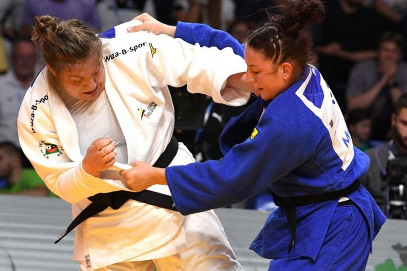 Germany's Anna-Monta Olek (Blue) and Belgium's Gabrielle Bouvier (White) compete in the women's +70 kg bout during the Judo's European Championships in Podgorica, on April 27, 2025. The tournament is taking place from April 23 to 27, 2025.   SAVO PRELEVIC / AFP