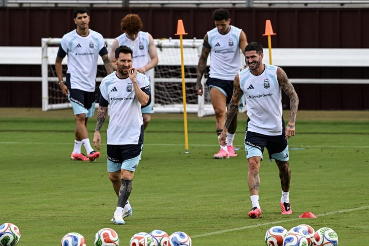 Argentina's players Lionel Messi (L) and Rodrigo De Paul (R) participate in a training session at Kyle Field in College Station, Texas, on June 5, 2026, the day before a friendly match against Honduras. Argentina will face Honduras in a friendly match on June 6, 2026.  RONALDO SCHEMIDT / AFP
