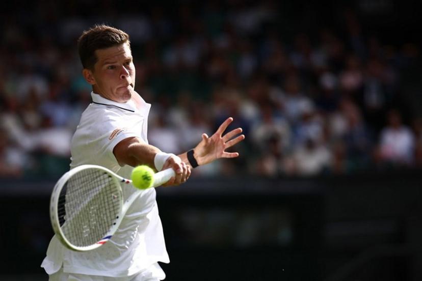 Belgium's Alexander Blockx returns against Germany's Alexander Zverev during their men's singles first round tennis match on the second day of the 2026 Wimbledon Championships at The All England Lawn Tennis and Croquet Club in Wimbledon, southwest London, on June 30, 2026.  HENRY NICHOLLS / AFP