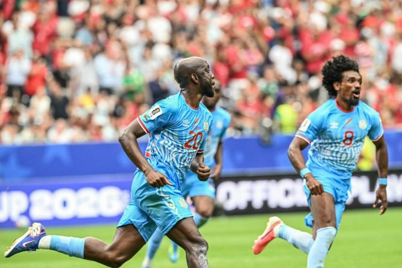 Congo DR's forward #20 Yoane Wissa (L) celebrates after scoring his team's first goal during the 2026 World Cup Group K football match between Portugal and the Democratic Republic of Congo at the Houston Stadium in Houston on June 17, 2026.   RONALDO SCHEMIDT / AFP