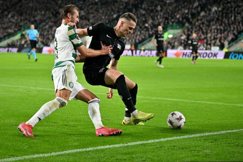 Celtic's Swedish midfielder #08 Benjamin Nygren battles for the ball with Sturm Graz's Belgian defender #24 Dimitri Lavalee during the UEFA Europa League league-stage football match between Celtic and Sturm Graz at Celtic Park in Glasgow on October 23, 2025.  ANDY BUCHANAN / AFP