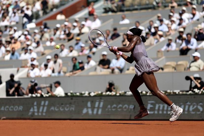 US Coco Gauff plays a backhand return to US Taylor Townsend during their women's singles match on day 3 of the French Open tennis tournament on Court Philippe-Chatrier at the Roland-Garros Complex in Paris on May 26, 2026.  Anne-Christine POUJOULAT / AFP