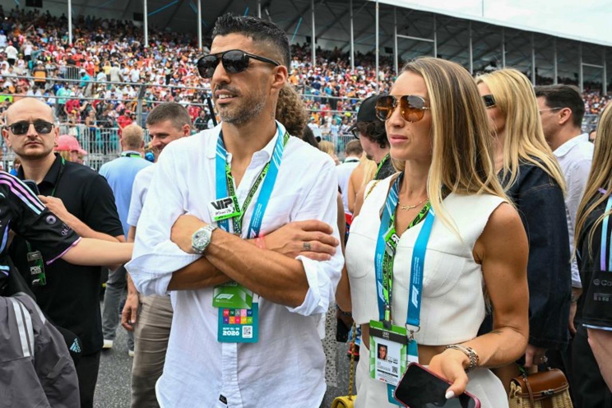 Inter Miami football player Uruguayan Luis Suarez and his wife Sofia Balbi tour the grid before the start of 2026 Miami Formula One Grand Prix at Miami International Autodrome in Miami Gardens, Florida, on May 3, 2026.  CHANDAN KHANNA / AFP