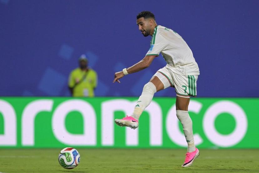 Algeria's forward #7 Riyad Mahrez kicks to score his team's third goal during the 2026 World Cup Group J football match between Algeria and Austria at the Kansas City Stadium in Kansas City on June 27, 2026.   JUAN MABROMATA / AFP