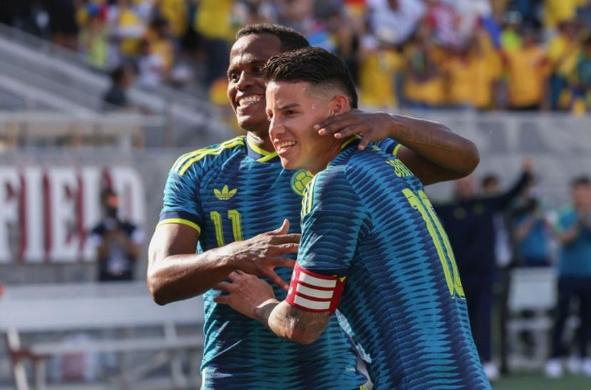 Colombia's midfielder #11 Jhon Arias celebrates with Colombia's midfielder #10 James Rodriguez after scoring a goal during the international friendly football match between Colombia and Jordan at Snapdragon Stadium in San Diego, California, on June 7, 2026.  SANDY HUFFAKER / AFP