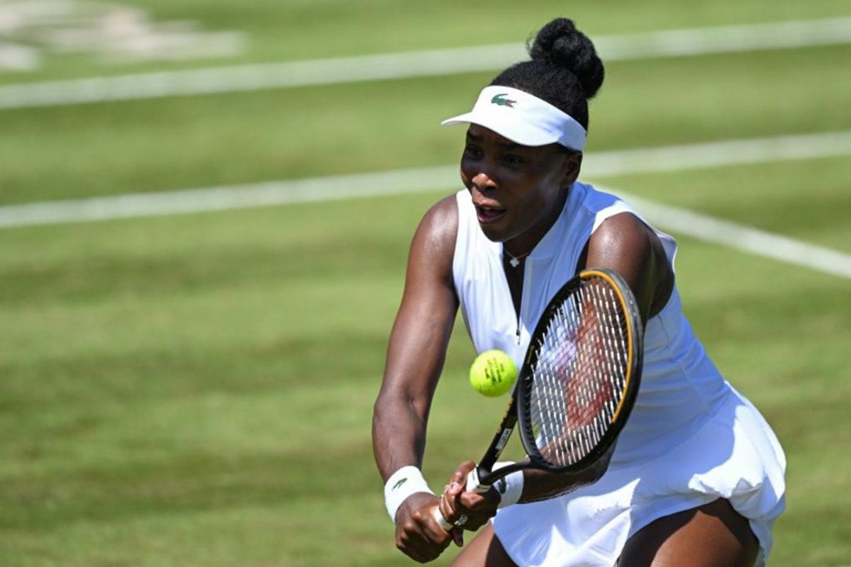 USA's Venus Williams hits a return as she plays with Philippines' Alexandra Eala against Britain's Olivia Nicholls and Russia's Tereza Mihalikova during the women's doubles quarter-final match of the WTA 500 Bad Homburg Open tennis tournament in Bad Homburg, western Germany on June 25, 2026.  Kirill KUDRYAVTSEV / AFP