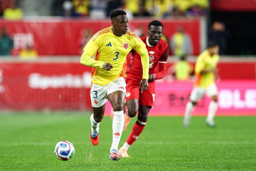 Colombia's defender #03 Jhon Lucumi controls the ball during the international friendly football match between Canada and Colombia at Sports Illustrated Stadium in Harrison, New Jersey, on October 14, 2025.  CHARLY TRIBALLEAU / AFP