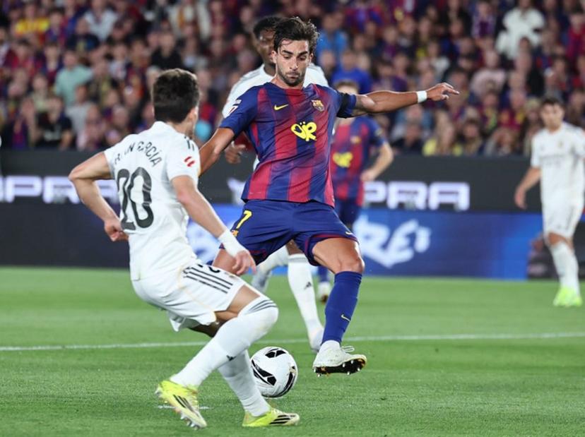 Barcelona's Spanish forward #07 Ferran Torres scores his team's second goal during the Spanish league football match between FC Barcelona and Real Madrid CF at Camp Nou Stadium in Barcelona on May 10, 2026.  Josep LAGO / AFP
