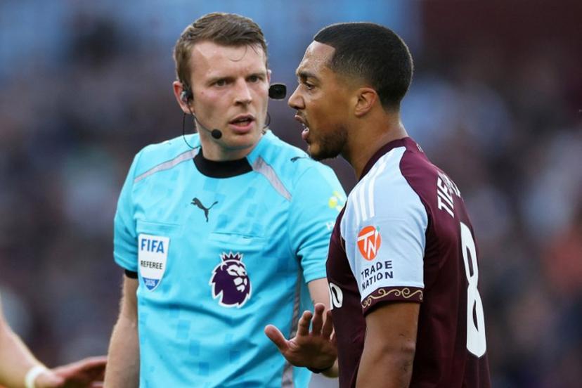 Referee Sam Barrott speaks with Aston Villa's Belgian midfielder  #08 Youri Tielemans (R) during the English Premier League football match between Aston Villa and Tottenham Hotspur at Villa Park in Birmingham, central England on May 3, 2026.  Adrian Dennis / AFP