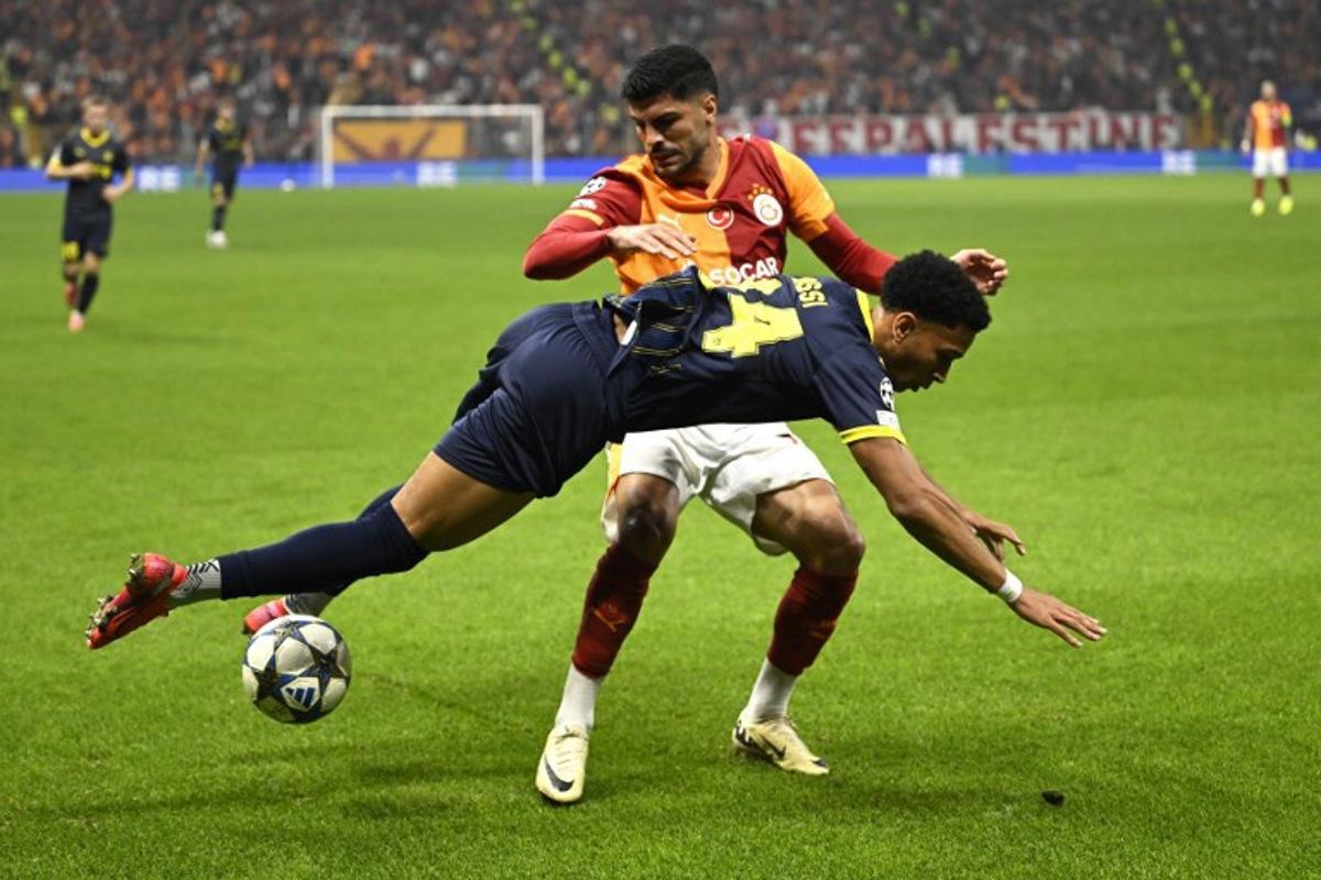 Galatasaray's Turkish defender #17 Evren Eren Elmali fouls Bodo/Glimt's Norwegian forward #24 Daniel Bassi during the UEFA Champions League, league phase - day 3, football match between Galatasaray SK and Bodo/Glimt at the Rams Park in Istanbul on October 22, 2025.  YASIN AKGUL / AFP