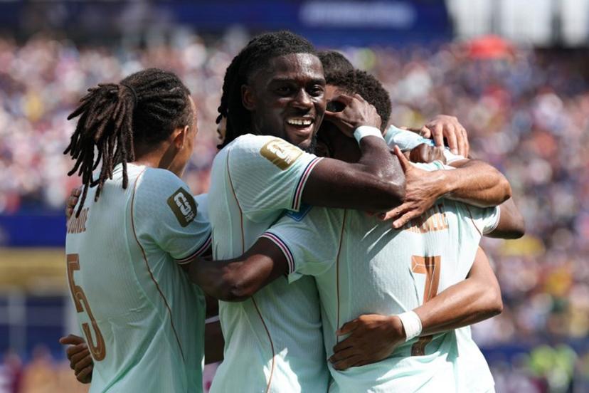 France's forward #07 Ousmane Dembele (R) celebrates scoring his team's third goal with midfielder #06 Manu Kone during the 2026 World Cup Group I football match between Norway and France at the Boston Stadium in Foxborough on June 26, 2026.  FRANCK FIFE / AFP