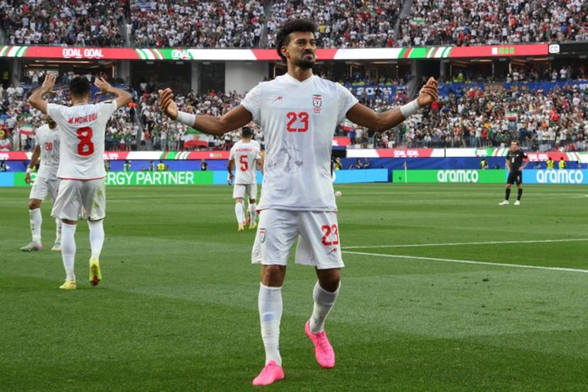 Iran's defender #23 Ramin Rezaeian celebrates scoring his team's first goal during the 2026 World Cup Group G football match between Iran and New Zealand at Los Angeles Stadium in Inglewood on June 15, 2026.   Patrick T. Fallon / AFP