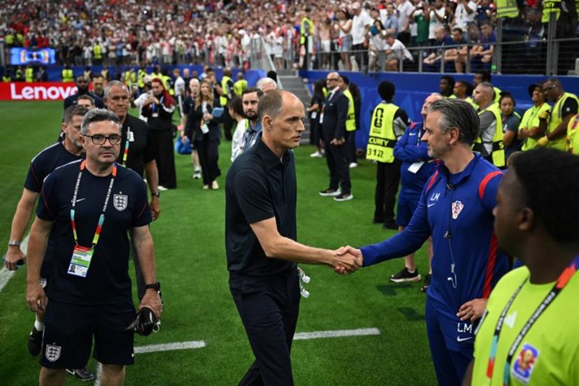 England's German head coach Thomas Tuchel (C) shakes hands with a Croatia staff member as he arrives for the 2026 World Cup Group L football match between England and Croatia at the Dallas Stadium in Arlington on June 17, 2026.   Paul ELLIS / AFP