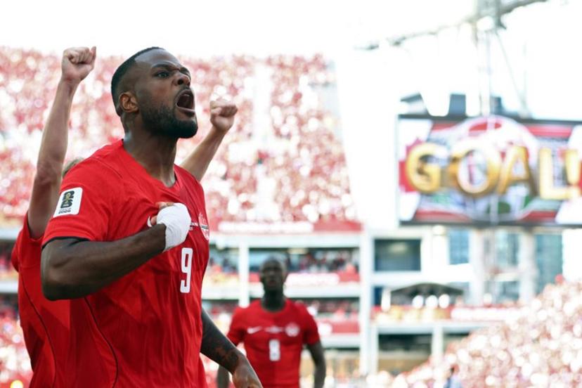 Canada's forward #09 Cyle Larin (R) celebrates after scoring a goal during the 2026 World Cup Group B football match between Canada and Bosnia and Herzegovina at the Toronto Stadium in Toronto on June 12, 2026.  Cole Burston / AFP