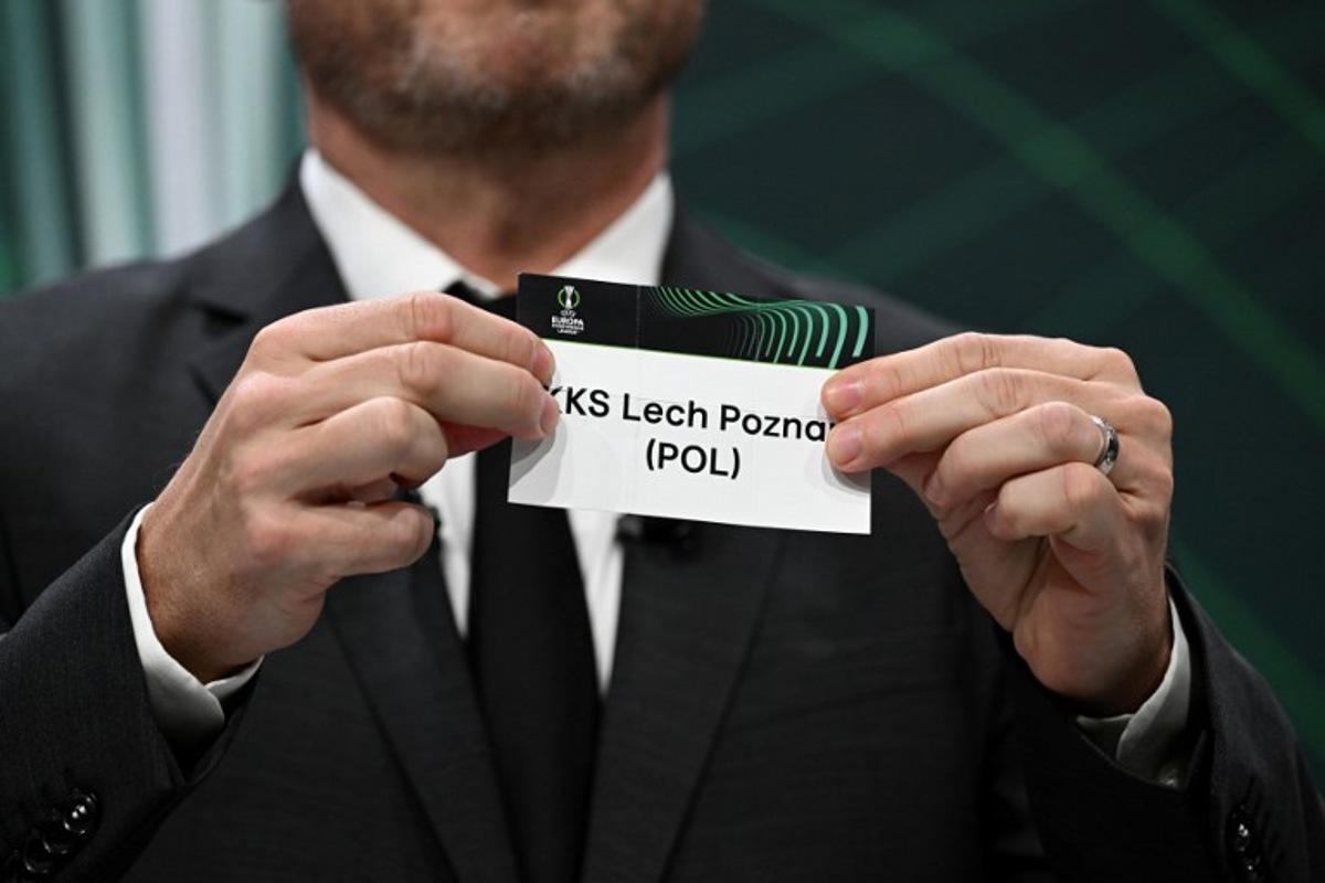 UEFA Europa Conference League final ambassador Czech former footballer Vladimir Smicer shows the paper slip of KKS Lech Poznan (POL) during the draw for the quarter-final, semi-final and final of the 2022-2023 UEFA Europa Conference League football tournament, in Nyon, on March 17, 2023.  Fabrice COFFRINI / AFP