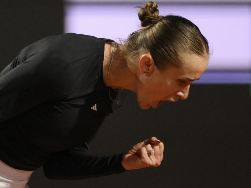 Ukraine's Elina Svitolina celebrates after scoring a point against Kazakhstan's Elena Rybakina during the ATP Rome Open tennis tournament at Foro Italico in Rome on May 13, 2026.   Tiziana FABI / AFP