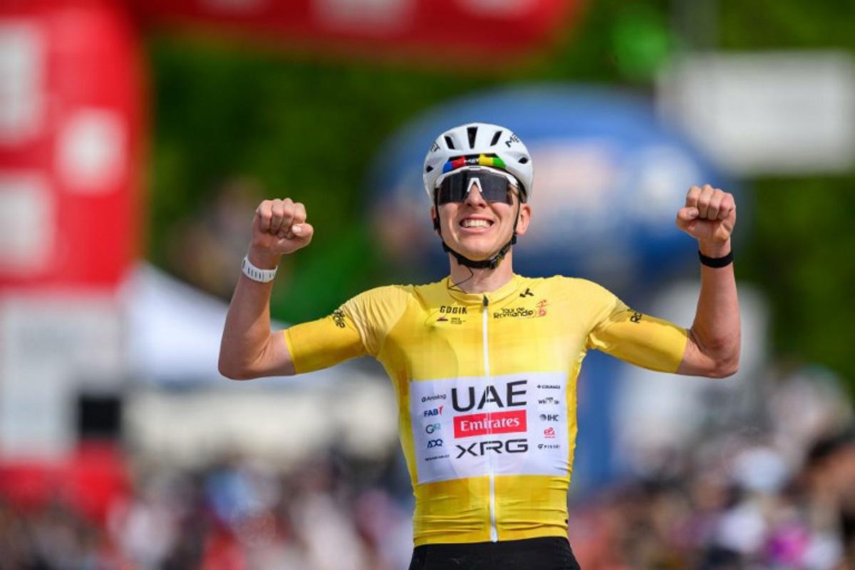 UAE Team Emirates-XRG's Slovenian rider Tadej Pogacar celebrates as he crosses the finish line wining the fourth stage of the Tour of Romandie UCI cycling World tour, 149.6 km from Broc and to Charmey, in Charmey, Switzerland, on May, 2, 2026.  Fabrice COFFRINI / AFP