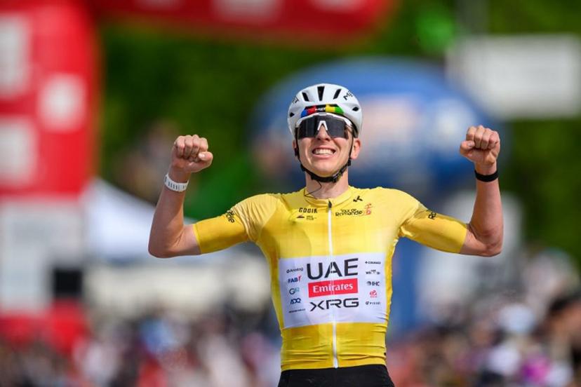 UAE Team Emirates-XRG's Slovenian rider Tadej Pogacar celebrates as he crosses the finish line wining the fourth stage of the Tour of Romandie UCI cycling World tour, 149.6 km from Broc and to Charmey, in Charmey, Switzerland, on May, 2, 2026.  Fabrice COFFRINI / AFP