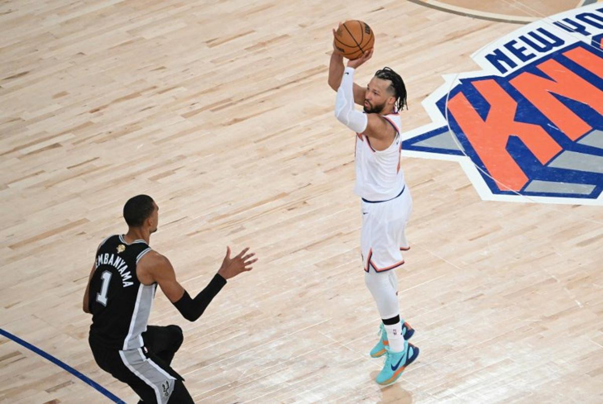 San Antonio Spurs' French forward-center #01 Victor Wembanyama looks on as Knicks guard #11 Jalen Brunson takes a shot on basket during Game Three of the NBA Finals between the San Antonio Spurs and the New York Knicks at Madison Square Garden in New York on June 8, 2026.  SAUL LOEB / AFP