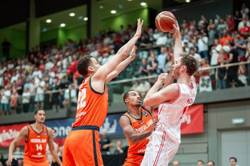 Netherlands' Jesse Edwards, Lucas Kruithof, Jamie Bergens and Austria's Jakob Poltl vie for the ball during pre-qualification match for the 2027 Men's Basketball World Cup between Austria and the Netherlands in Schwechat, Austria, on August 13, 2025.  GEORG HOCHMUTH / APA / AFP