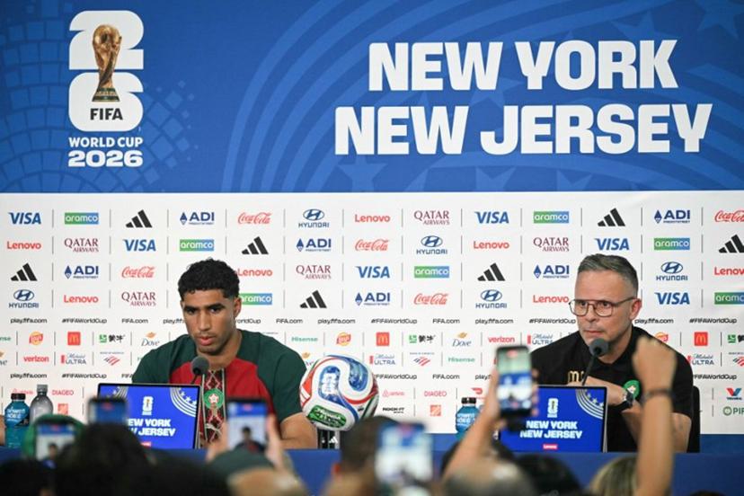 Morocco's head coach Mohamed Ouahbi (R) speaks alongside Morocco's Achraf Hakimi during a press conference at the New York/New Jersey Stadium in East Rutherford on June 12, 2026, on the eve of the 2026 World Cup football match between Brazil and Morocco.  Mauro PIMENTEL / AFP